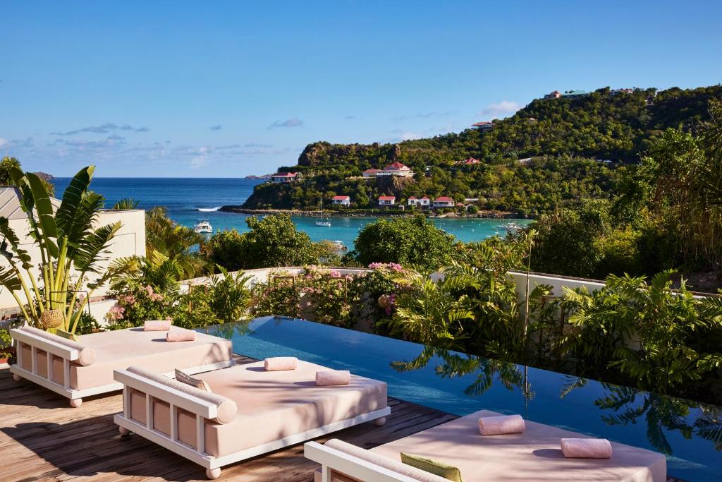 a villa with a view of the ocean at Tropical Hotel St Barth in Gustavia