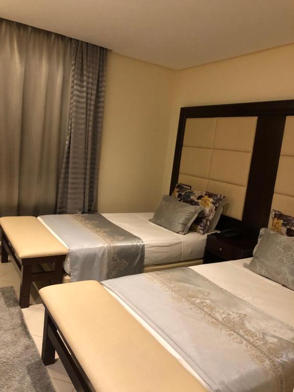 Postel nebo postele na pokoji v ubytování Dream's Hotel