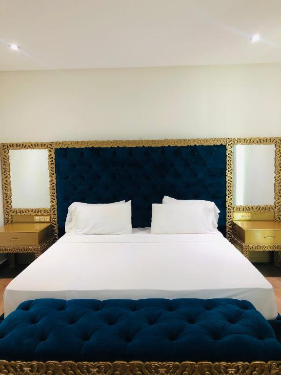Postel nebo postele na pokoji v ubytování Dream's Hotel