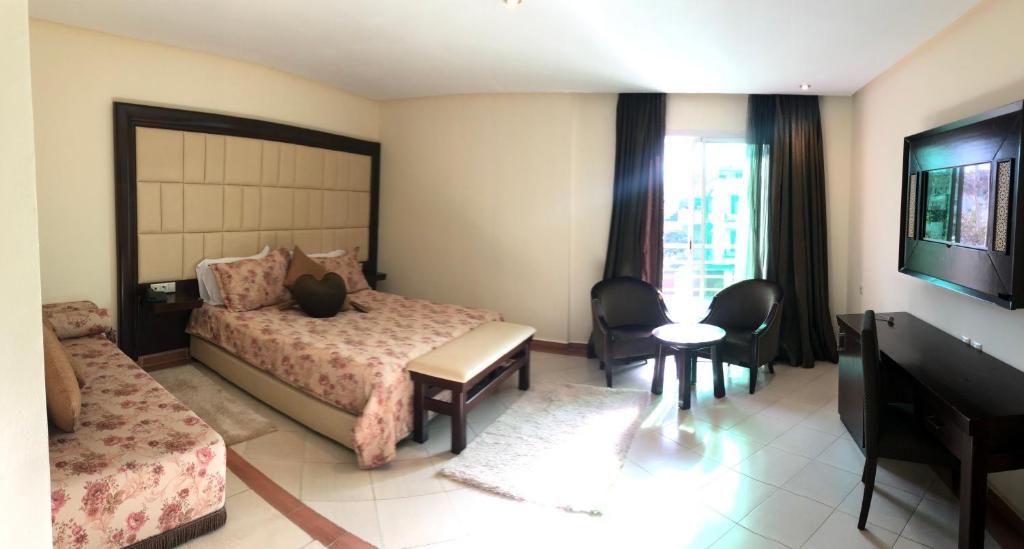 Postel nebo postele na pokoji v ubytování Dream's Hotel