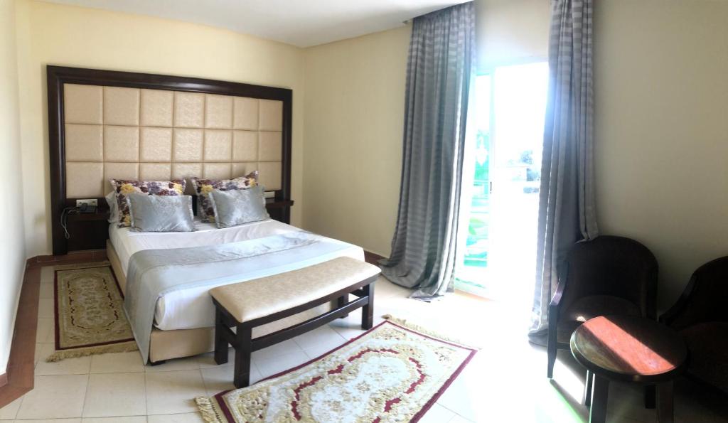 Postel nebo postele na pokoji v ubytování Dream's Hotel