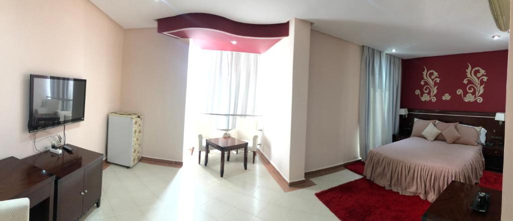 Postel nebo postele na pokoji v ubytování Dream's Hotel