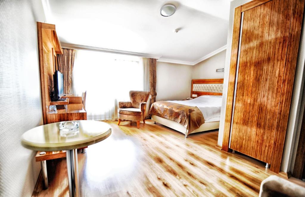Postel nebo postele na pokoji v ubytování Serenti Pamuk Hotel