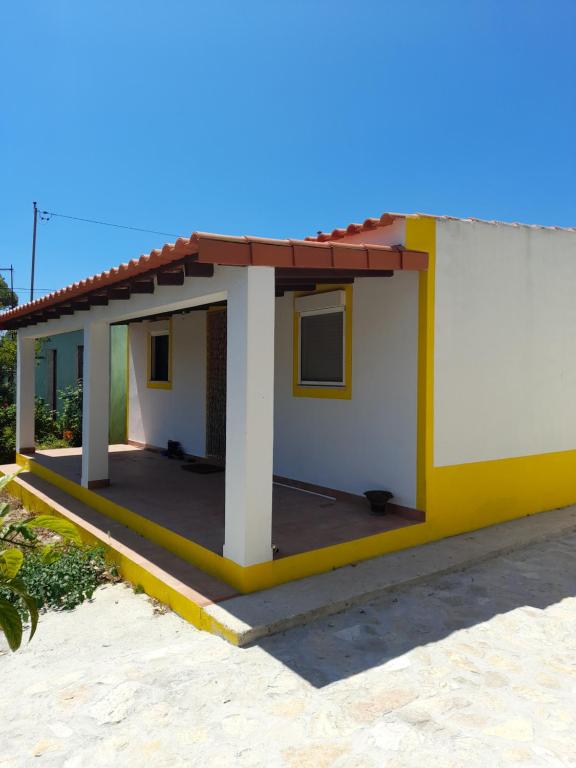 a small house with a red roof at Nadadouro Eco-country-cottage in Nadadouro