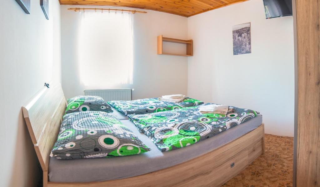 Postel nebo postele na pokoji v ubytování Penzion V Údolí