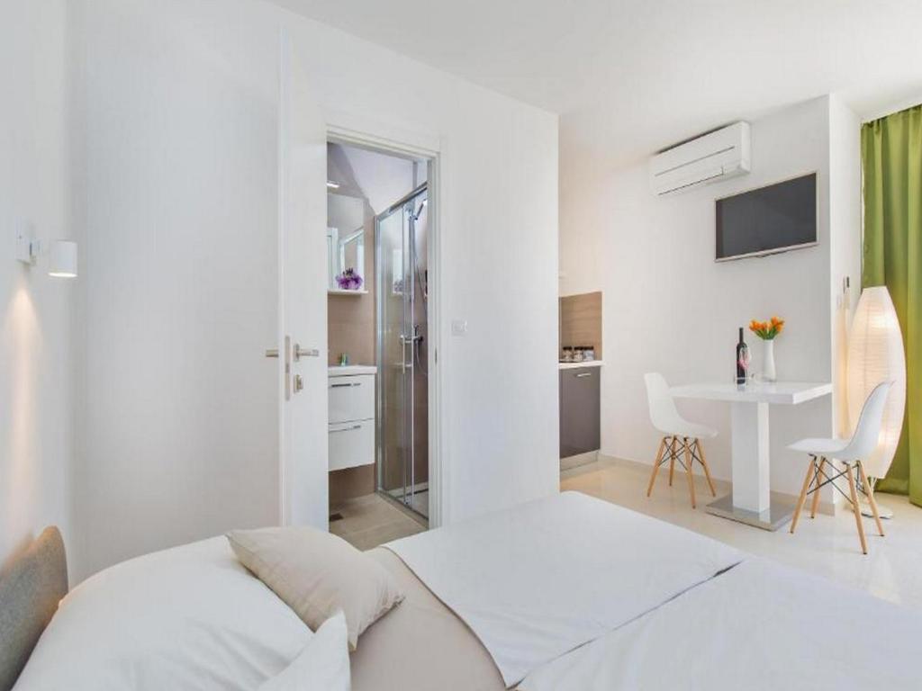 Posteľ alebo postele v izbe v ubytovaní Apartments St Thomas