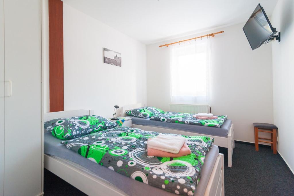 Postel nebo postele na pokoji v ubytování Penzion V Údolí