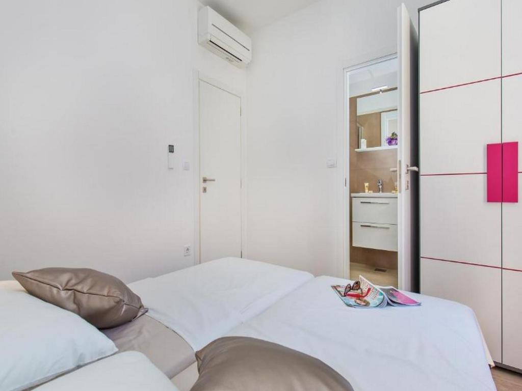 Posteľ alebo postele v izbe v ubytovaní Apartments St Thomas