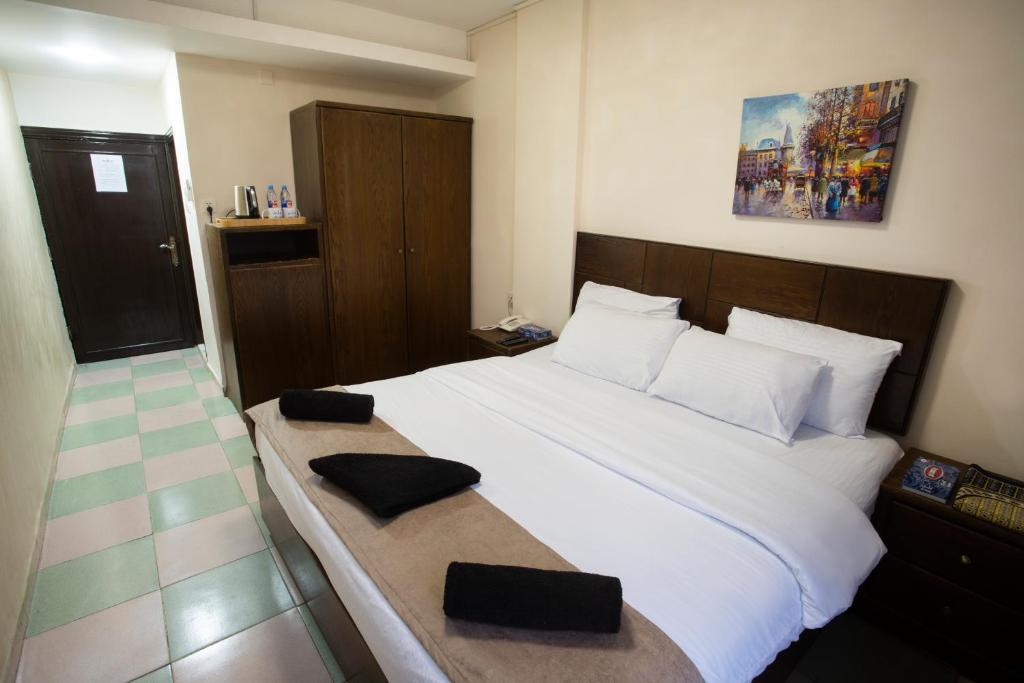 Postel nebo postele na pokoji v ubytování Darak hotel