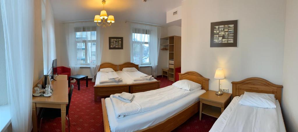 Postel nebo postele na pokoji v ubytování Alexa Old Town