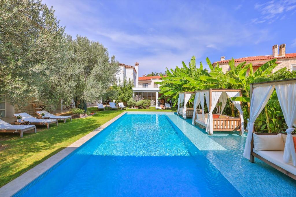 a swimming pool in the backyard of a villa at Kose Konak Butik Hotel-Special in Alacati