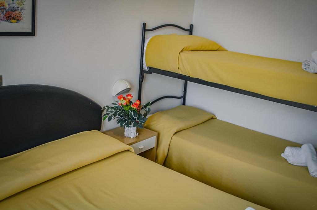Postel nebo postele na pokoji v ubytování Hotel Stradiot