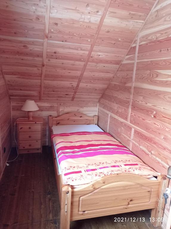 Posteľ alebo postele v izbe v ubytovaní Domek nad Potokiem