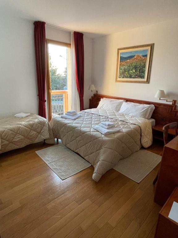 Postel nebo postele na pokoji v ubytování Hotel Fuori Città