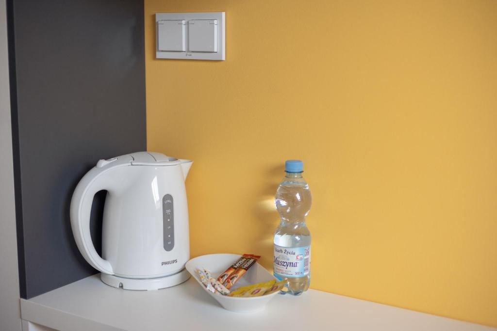 Príslušenstvo na prípravu kávy alebo čaju v ubytovaní ĄĘ Hostel Nowy Świat