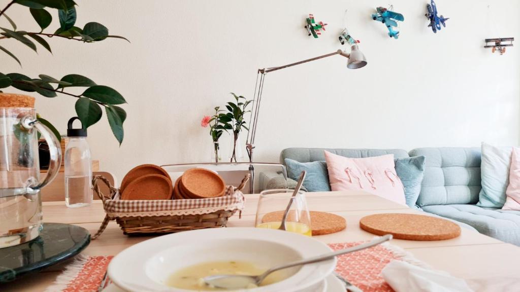 a living room with a table and a couch at Majesticlara Lisbon Guest House in Lisbon