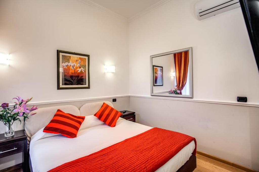 Postel nebo postele na pokoji v ubytování Hotel Everest Inn Rome