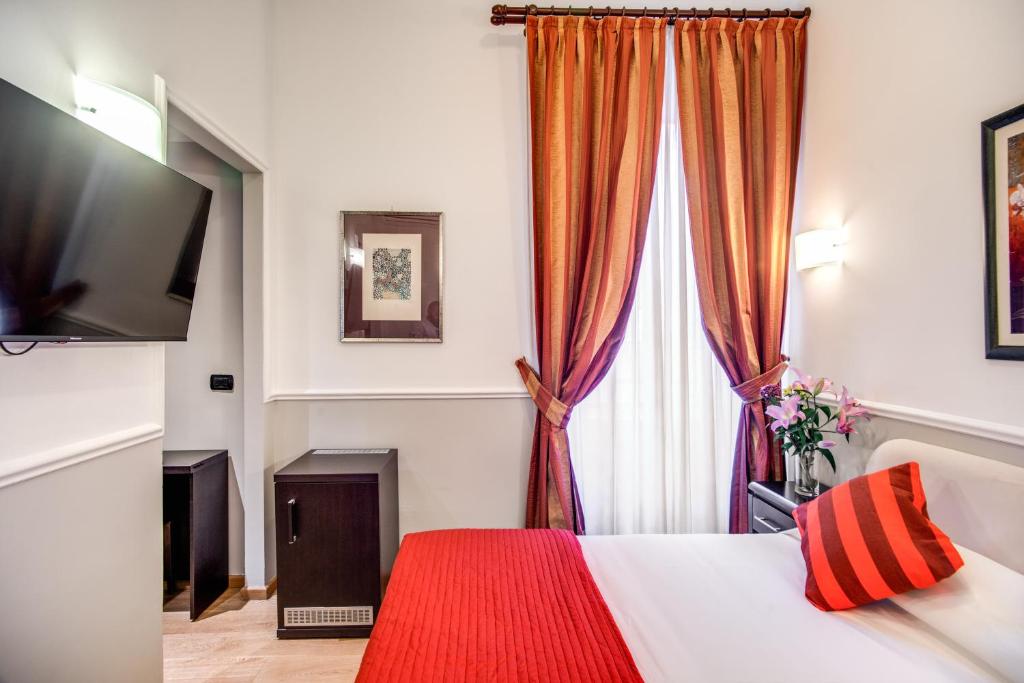 Postel nebo postele na pokoji v ubytování Hotel Everest Inn Rome