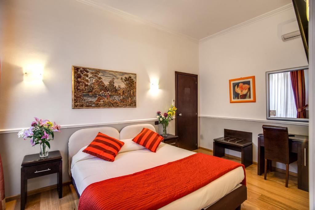 Postel nebo postele na pokoji v ubytování Hotel Everest Inn Rome