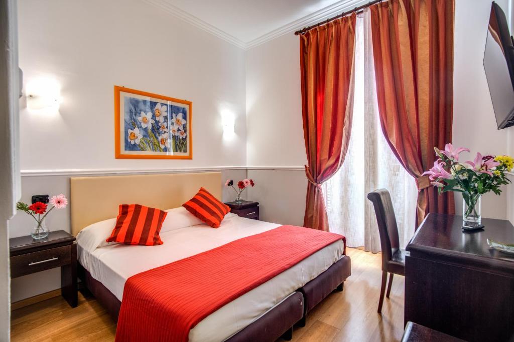 Postel nebo postele na pokoji v ubytování Hotel Everest Inn Rome