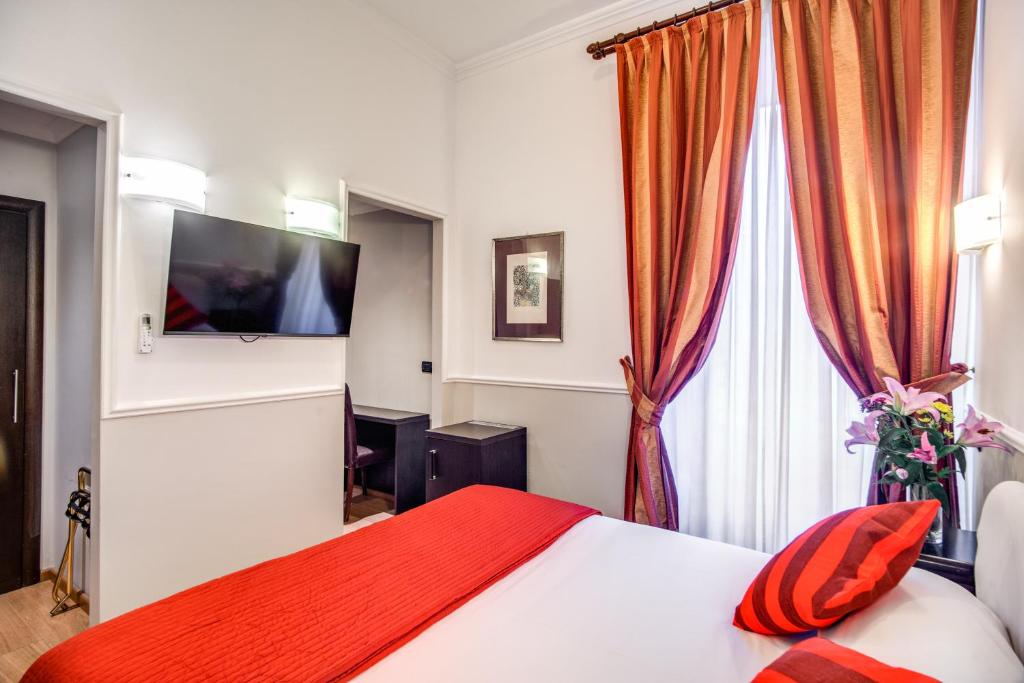 Postel nebo postele na pokoji v ubytování Hotel Everest Inn Rome