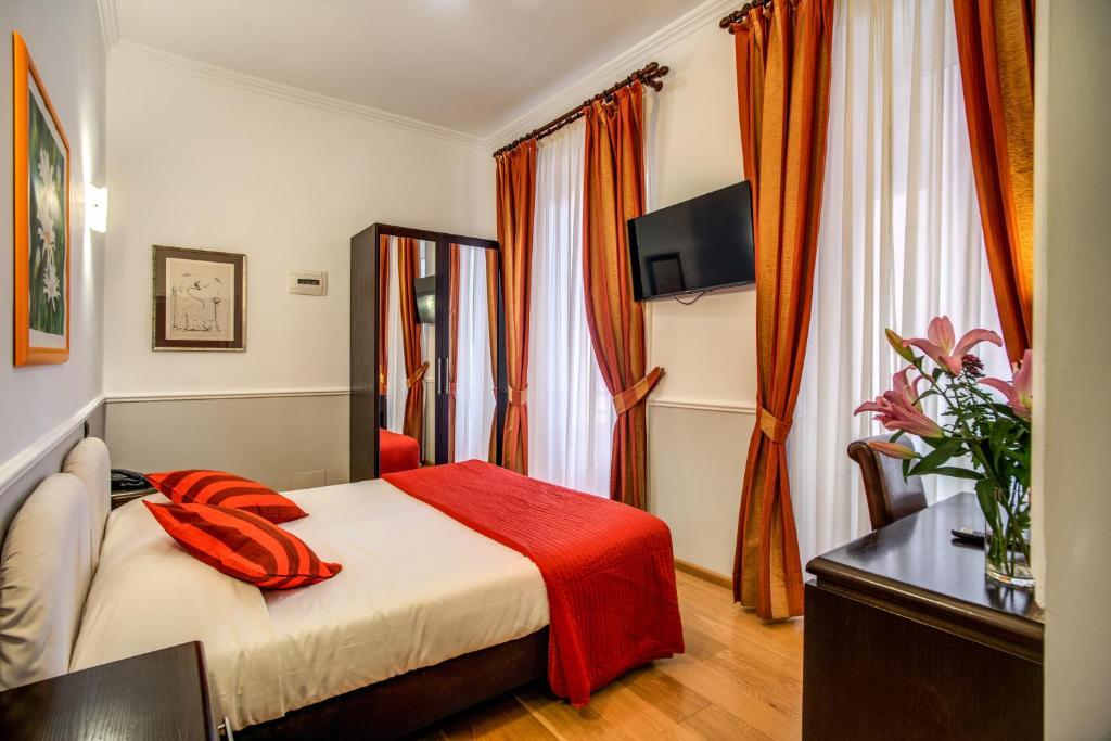 Postel nebo postele na pokoji v ubytování Hotel Everest Inn Rome
