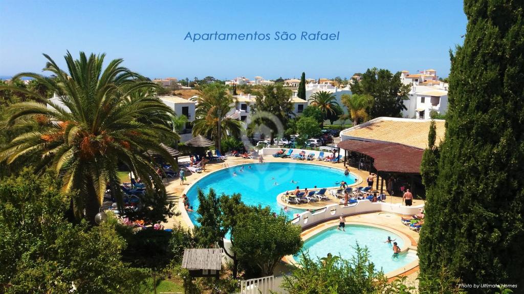a view of a swimming pool in a resort at Apartamentos São Rafael - Albufeira, Algarve in Albufeira