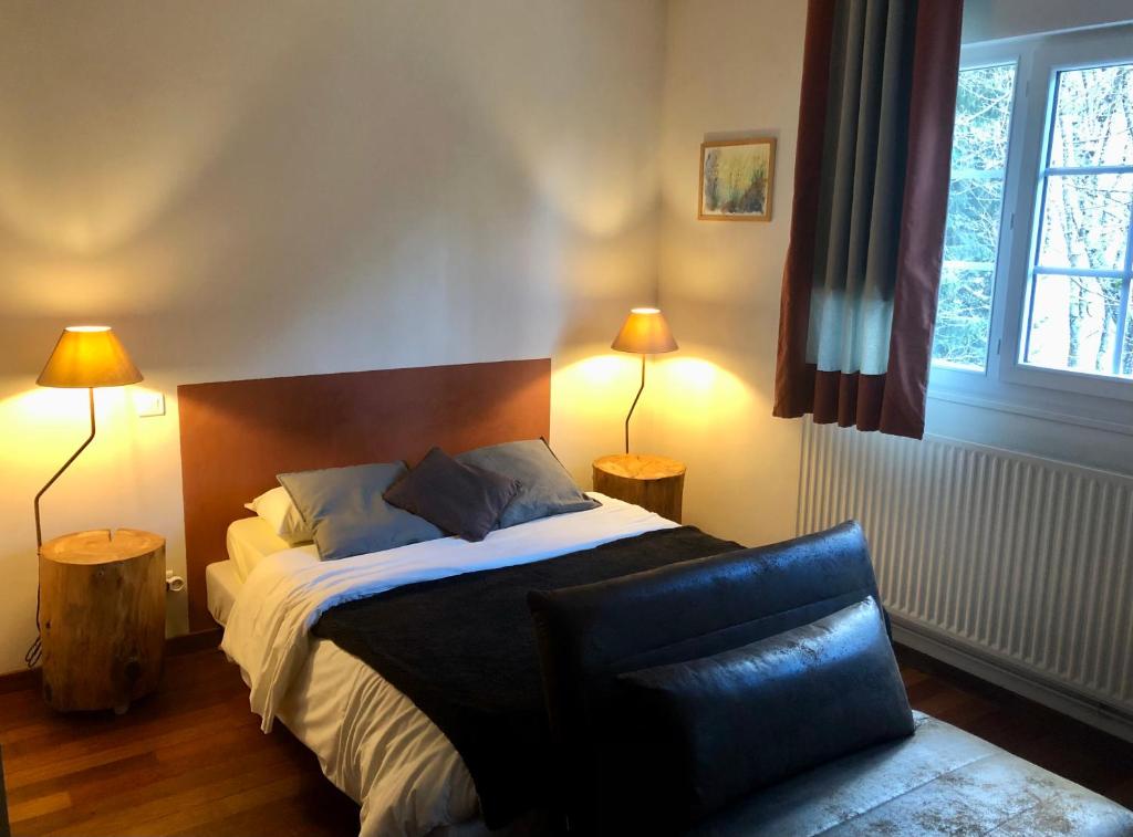 Postel nebo postele na pokoji v ubytování Maison d'hoursentut