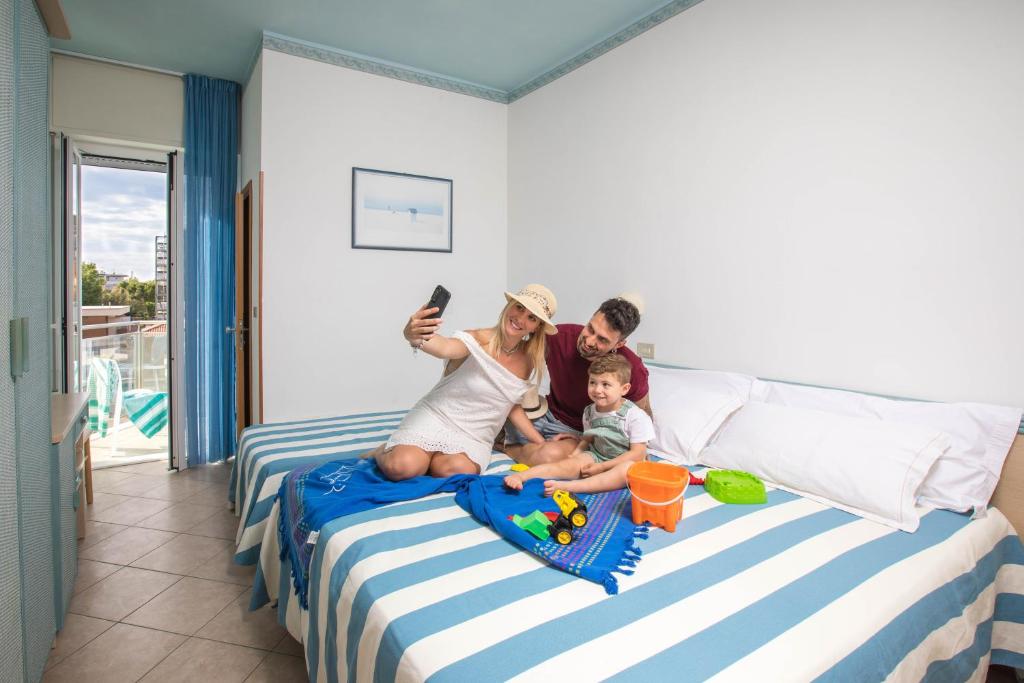 Postel nebo postele na pokoji v ubytování Hotel Tabor