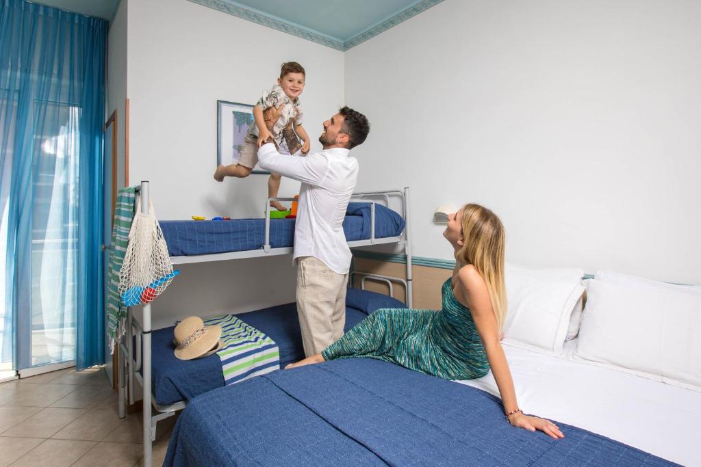 Postel nebo postele na pokoji v ubytování Hotel Tabor