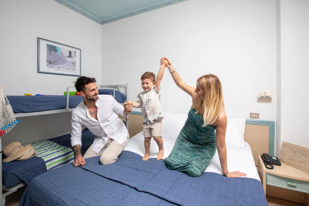 Postel nebo postele na pokoji v ubytování Hotel Tabor