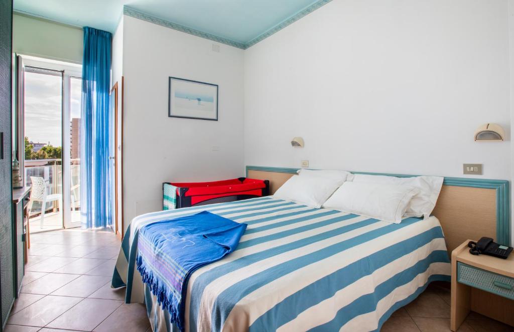 Postel nebo postele na pokoji v ubytování Hotel Tabor