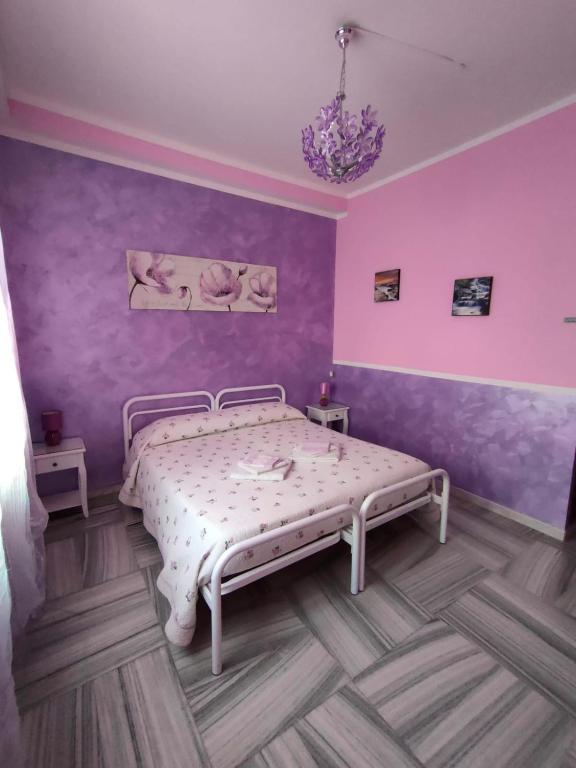 Postel nebo postele na pokoji v ubytování Hotel Serenella
