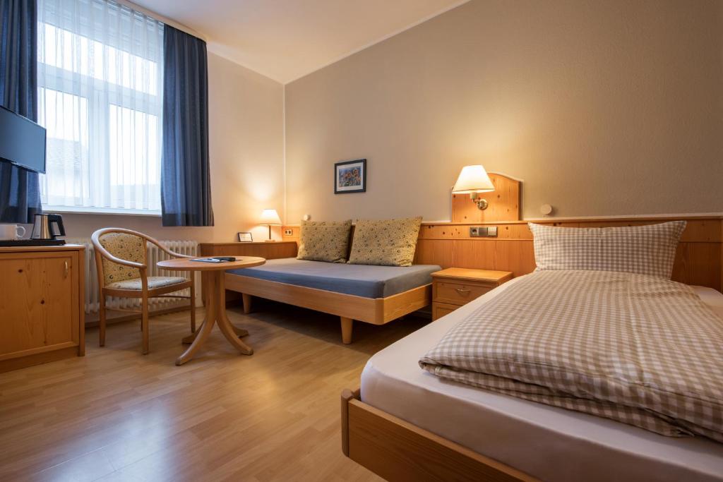 Postel nebo postele na pokoji v ubytování Gasthof zur Krone