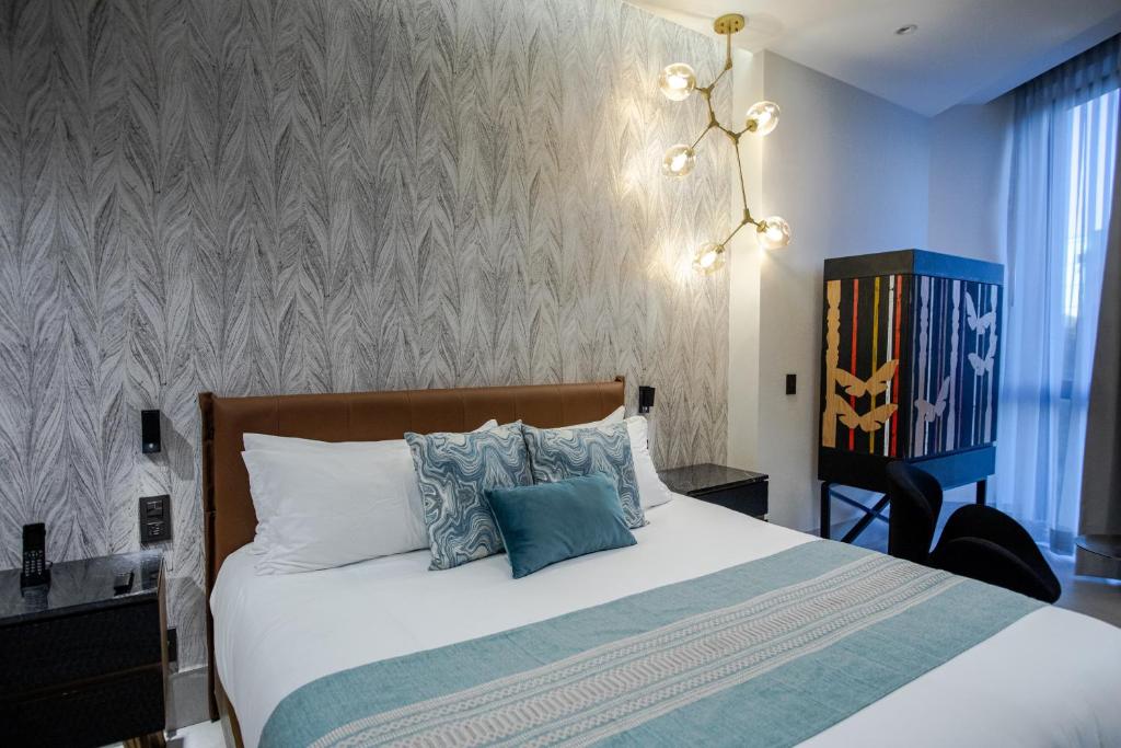 Postel nebo postele na pokoji v ubytování Becquer Hotel Guadalajara