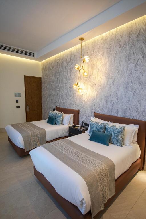 Postel nebo postele na pokoji v ubytování Becquer Hotel Guadalajara