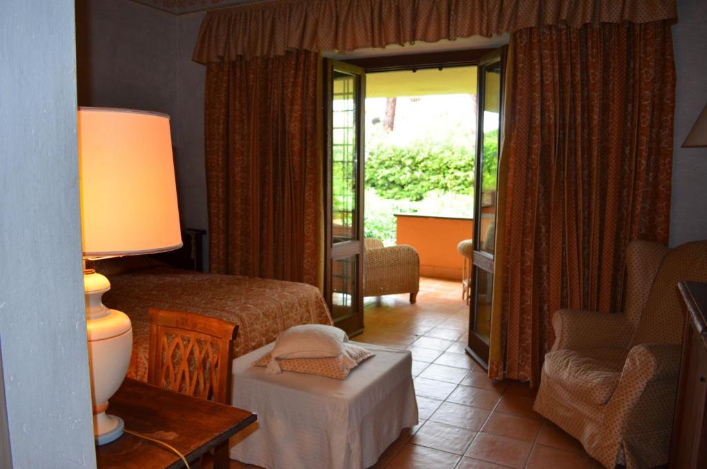 A bed or beds in a room at Hotel La Locanda Dei Ciocca
