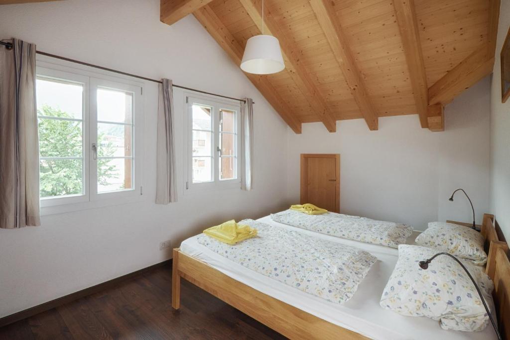 Postel nebo postele na pokoji v ubytování CityChalet