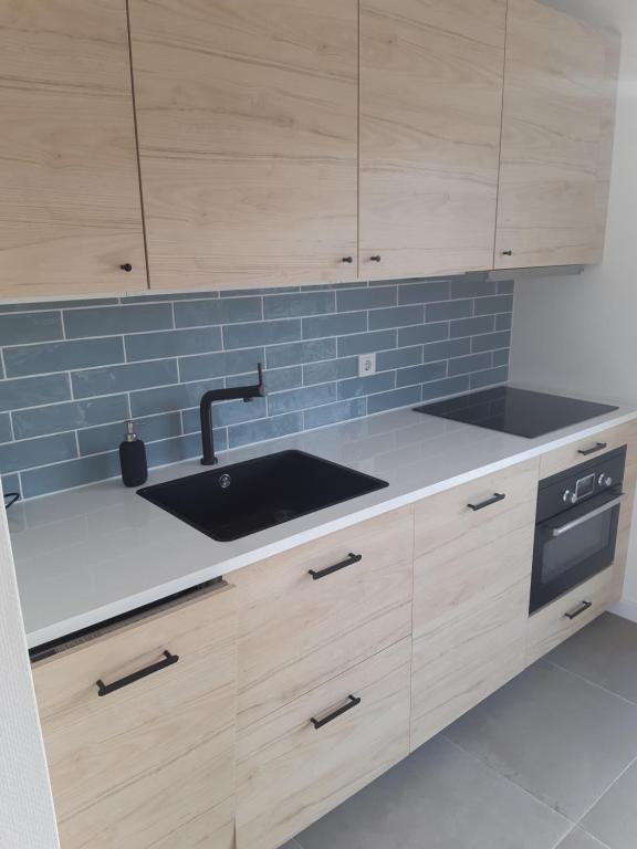 Kuchyň nebo kuchyňský kout v ubytování Recreatiewoning Den Hollander
