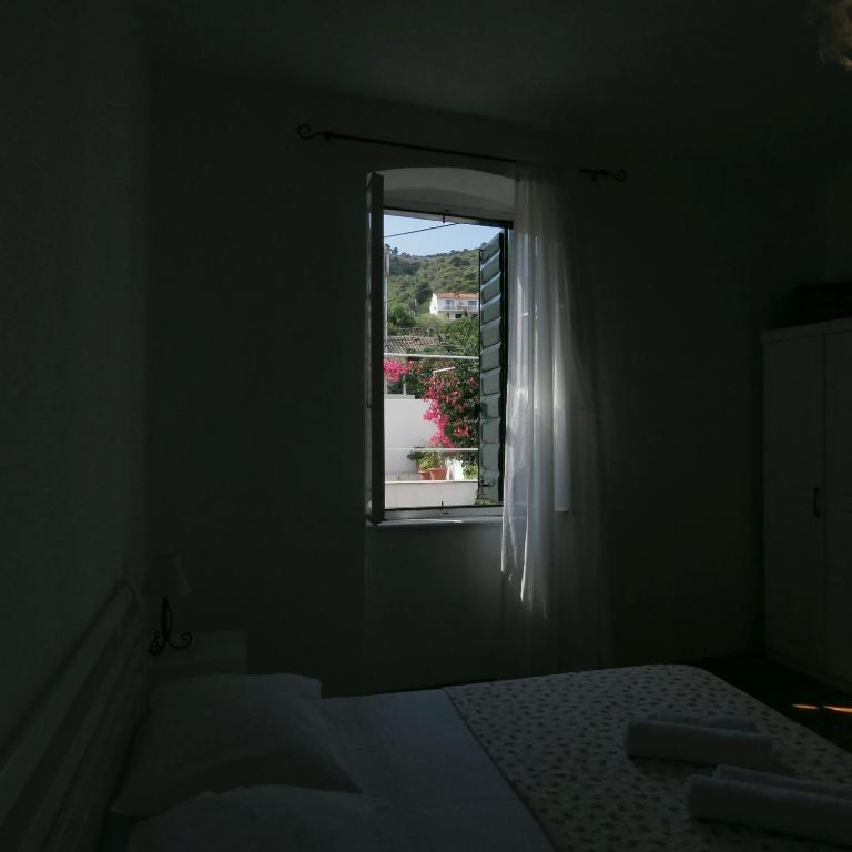Postel nebo postele na pokoji v ubytování Lovely apartment in old part of Vis