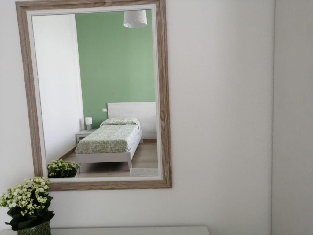 A bed or beds in a room at Sa Banita affittacamere