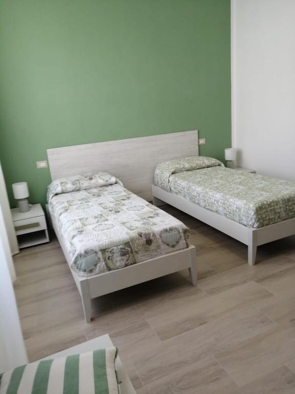 A bed or beds in a room at Sa Banita affittacamere
