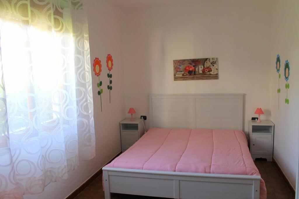 Postel nebo postele na pokoji v ubytování Lacona Mare - HelloElba