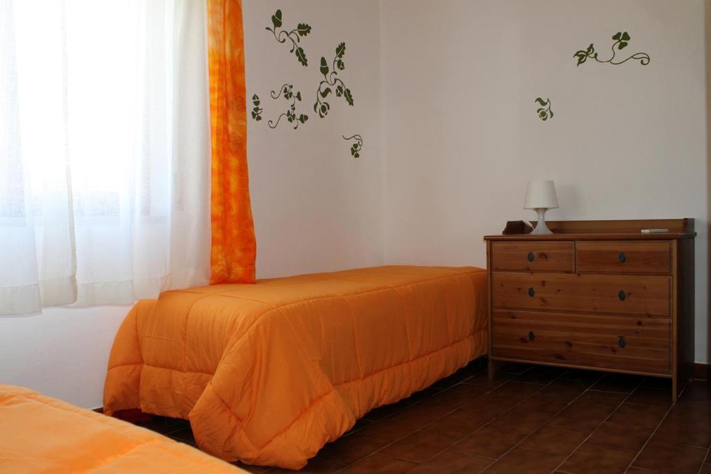 Postel nebo postele na pokoji v ubytování Lacona Mare - HelloElba