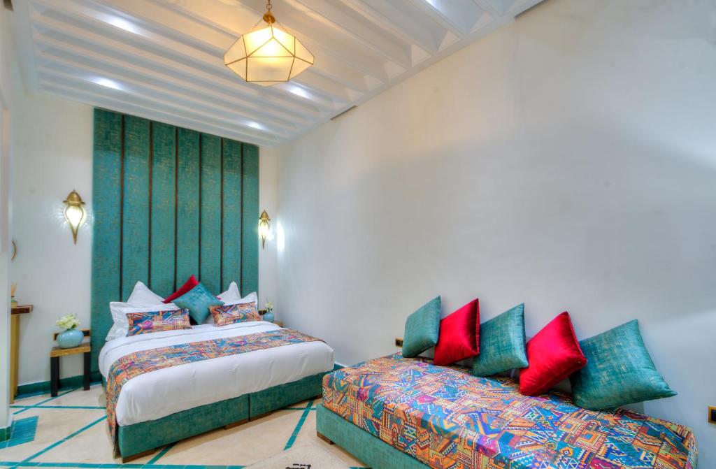 Ein Bett oder Betten in einem Zimmer der Unterkunft riad paradis blanc
