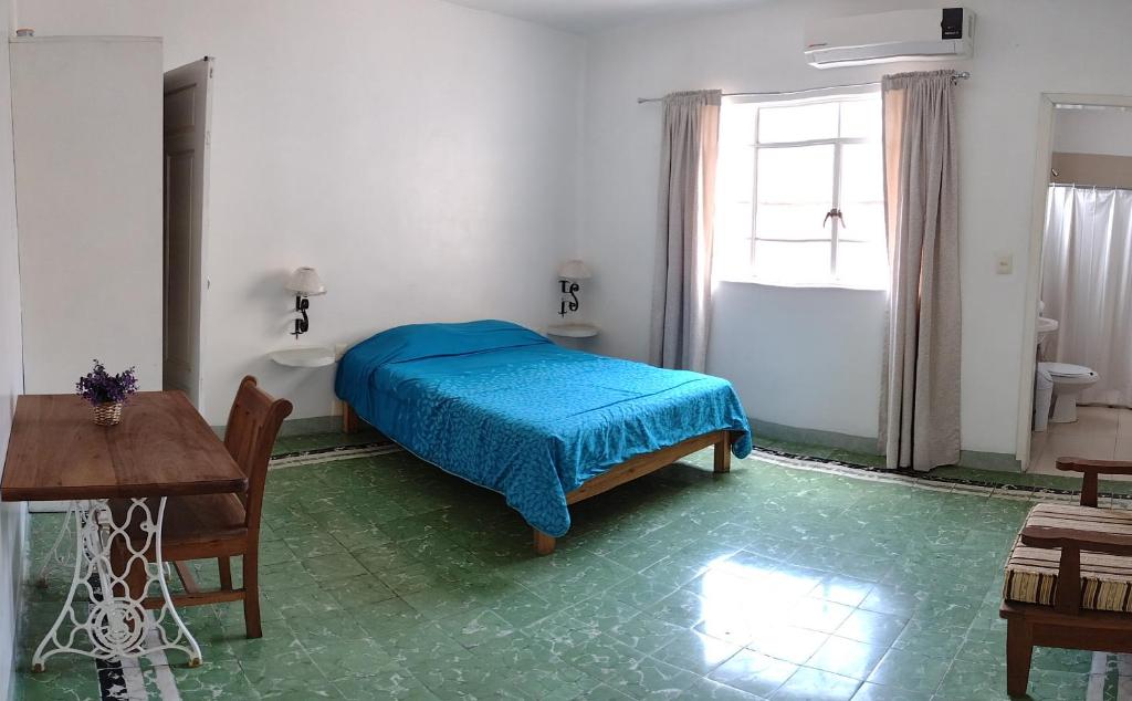 Postel nebo postele na pokoji v ubytování Hotel Suites Córdoba