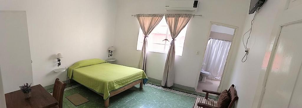 Postel nebo postele na pokoji v ubytování Hotel Suites Córdoba