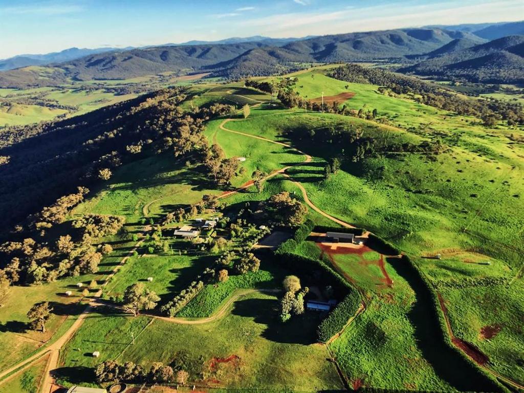 an aerial view of a golf course with mountains in the background at Elevation652 at Mt Bellevue in King Valley in Myrrhee