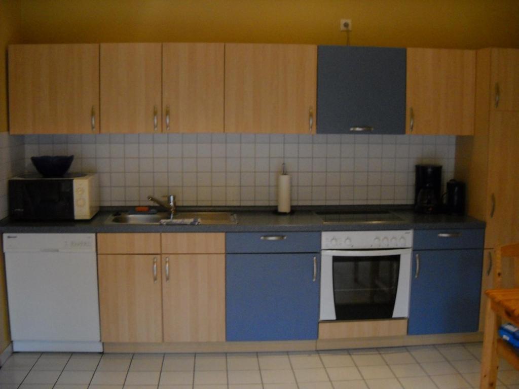 Kuchyň nebo kuchyňský kout v ubytování Ferienwohnung Wattwurm Dangast