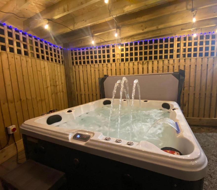 a bath tub with water coming out of it at Beautiful Holiday Home - Lake view in York